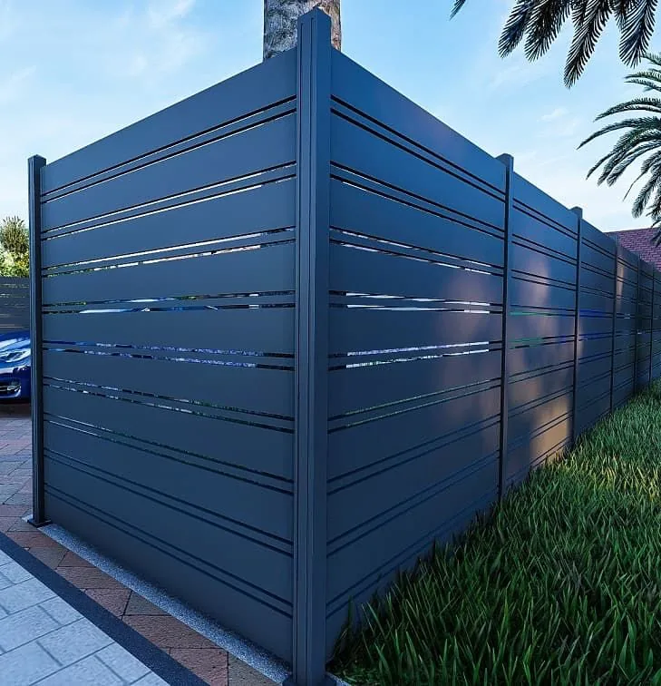 Dark gray horizontal-slat fence panel at the corner of a property